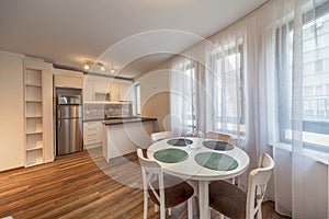 New modern living room with kitchen. New home. Interior photography. Wooden floor.