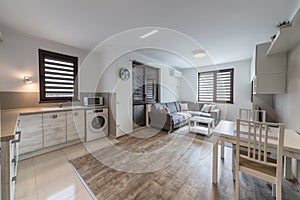 New modern living room with kitchen. New home. Interior photography. Wooden floor