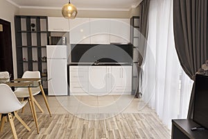 New modern living room with kitchen. New home. Interior photography. Wooden floor