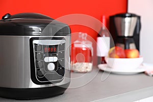 New modern multi cooker on table in kitchen