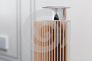 New modern musical columns made of wood and metal as a source of pure sound in sunshine.