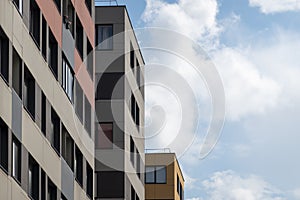 New modern residential apartment buildings with blue sky background. Abstract architecture details