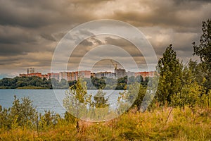 new modern residential area near the lake on summer day