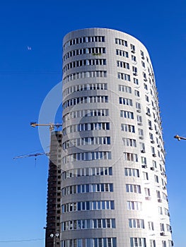 New modern, residential, high-rise building built of concrete and brick.