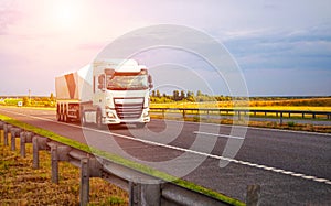 A new modern semi-trailer glass truck transports fragile cargo in the form of glass and mirrors along the highway