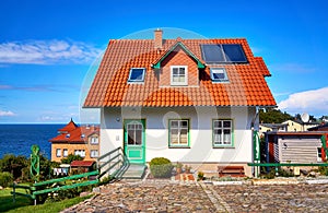 New modern single family house with red roof tiles and solar panels. Living overlooking the Baltic Sea on the island of RÃ¼gen