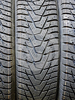 New modern studdable winter tire tread closeup withouts studs