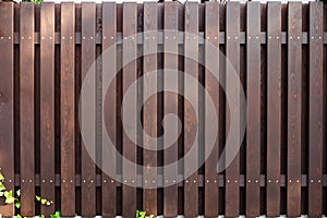 New modern wooden fence dark brown color