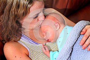 New Mom Kisses Newborn Baby