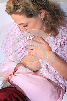 New Mom Nursing Newborn Baby