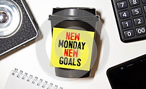 New Monday, new week, new goals - handwriting on a napkin with a cup of coffee