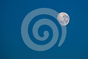 New moon with a blue sky in the background