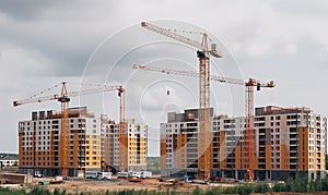 New multi-storey houses under construction with cranes and scaffolding Creating using generative AI tools