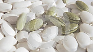 New natural green pills are falling on top of ordinary white chemical medicines. A symbol of new biomedicine and new