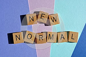 New Norma, word in 3D wooden alphabet letters isolated on colour background