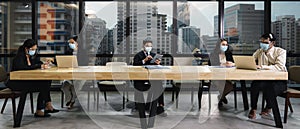 New normal practise businesspeople wear mask and keep social distance