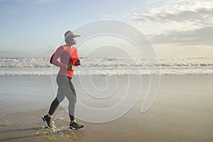 New normal running workout with face mask - attractive and happy middle aged woman on her 40s or 50s doing post quarantine jogging