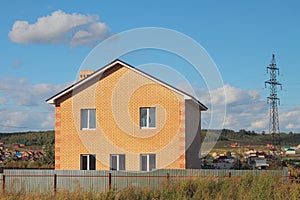 New not populated two-storeyed country house from brick