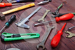 New and old of bench tools for repair work on wooden background