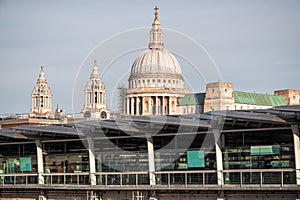 New and old, Blackfriars Railway Bridge and St Paul`s Cathedral in London