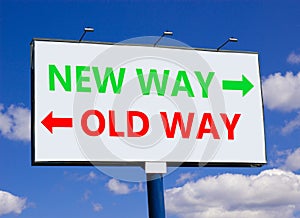 New or old way symbol. Concept word New way Old way on beautiful billboard with two arrows. Beautiful blue sky with clouds