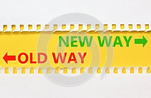 New or old way symbol. Concept word New way Old way on beautiful yellow paper. Beautiful white paper background. Business and new