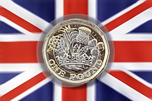 New one pound coin on a Union Jack background