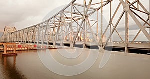 New Orleans aerial view ascending over the Mississippi River and the Highway Bridge Deck