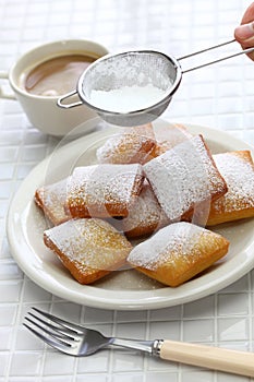 New orleans beignet, sprinkle powdered sugar with sieve