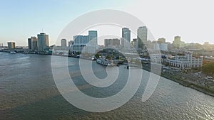 New Orleans Cityscape, Louisiana. City Skyline, Mississippi River and Steamboat Natchez in Background. Sunset Light II