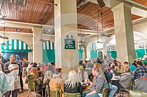 NEW ORLEANS - JANUARY 20, 2016: Cafe du Monde with tourists inside. The cafe is the most famous in New Orleans