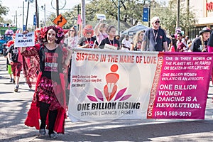 New Orleans, LA/USA - 2/19/2017: Marchers in Mardi Gras Parade on St. Charles Avenue Opposing Violence and Exploitation of women