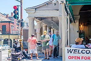 Buskers and Pedestrians Outside Cafe Du Monde