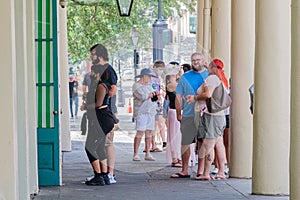 Tourists in line outside of Cafe Du Monde for takeout