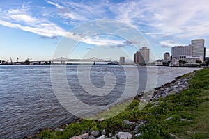 New Orleans Skyline and Crescent City Connection Bridge along the Mississippi River during the Evening