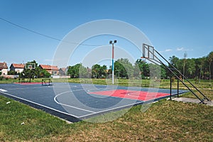 New outdoor basketball court with rubber surface