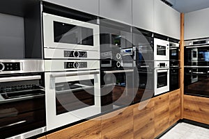 New ovens in household appliance section in store close up