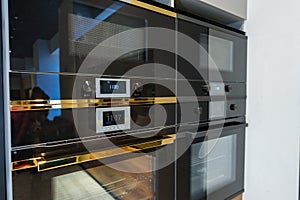 New ovens in household appliance section in store close up