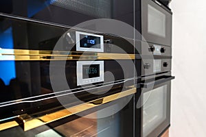 New ovens in household appliance section in store close up