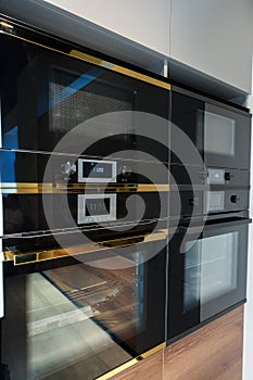 New ovens in household appliance section in store close up