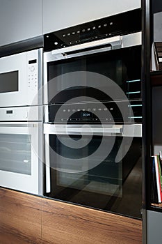 New ovens in household appliance section in store close up