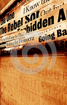 New paper headlines with old paper