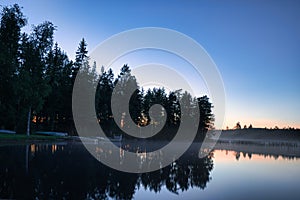 New paths, evening atmosphere at the lake. Light fog in the background