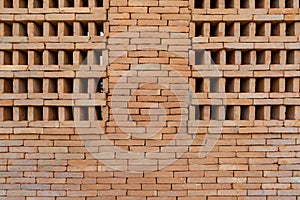 The new pattern of hole brick wall arrangement art with modern and vintage combination style for creative wall background design