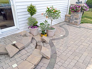 New paving bricks laid out on curved patio steps