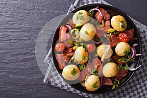 New potatoes with bacon, onion and tomato horizontal top view