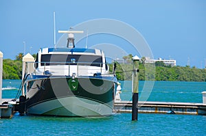 New power boat moored docked at marina dock