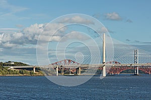 The new Queensferry Crossing bridge over the Firth of Forth with the older Forth Road bridge and the iconic Forth Rail Bridge in