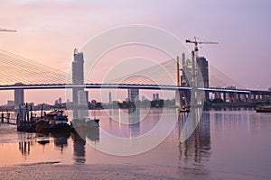 new Rama nine suspension bridge under construction cross Chao Phraya river in Thailand on night