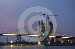 new Rama nine suspension bridge under construction cross Chao Phraya river in Thailand on night
